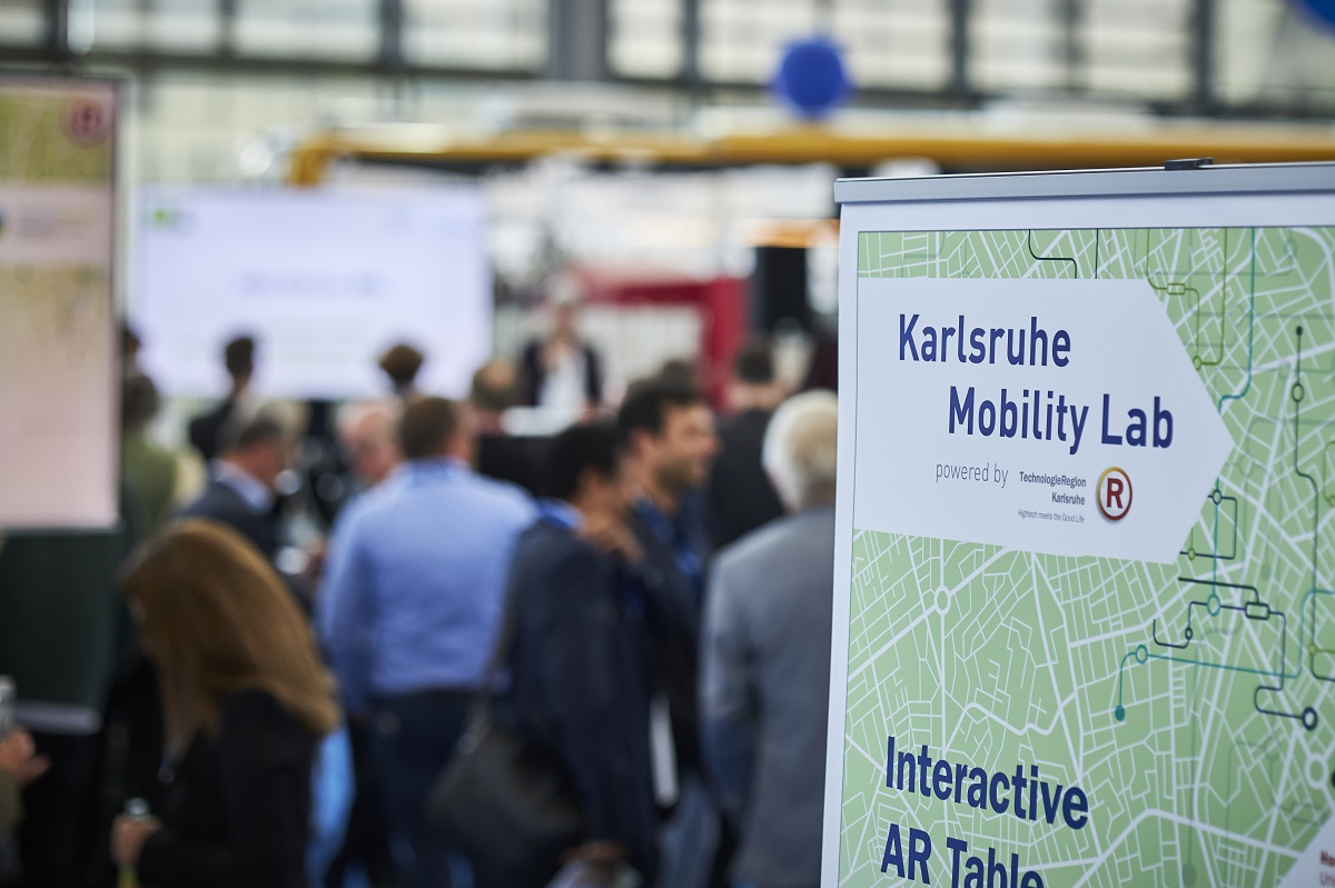 IT_TRANS's tweet photo. Transport food directly from the farm to the consumer via tram – that’s the idea of a project group at Offenburg University. The students showcased their concept of the so-called „Hofladentram“, a streetcar converted into a shop, at the Karlsruhe Mobility Lab at #ittrans 2022. https://t.co/AQ6GQRErQO