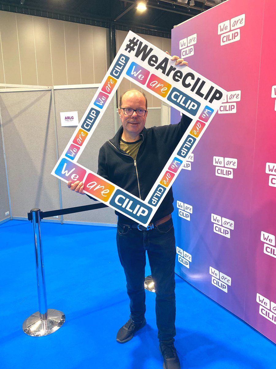 CILIPinfo's tweet photo. Calling all #CILIPConf22 delegates - pop over and say hello at our CILIP stand. Come into the ‘VIP’ area and take a selfie like our colleague, Andrew, or ask about a professional headshot. We hope you’re all having a great Day One! https://t.co/TsBoePUn9L