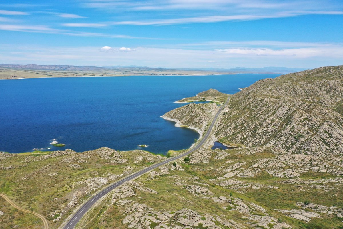 Outside of Shymkent: Picturesque road along the Bukhtarma Reservoir. 

The Bukhtarma Reservoir is 425 km long, covers an area of around 5,490 km² and it is #Kazakhstan's largest reservoir. It is located in East Kazakhstan region and is part of the Irtysh river.

#VisitKazakhstan