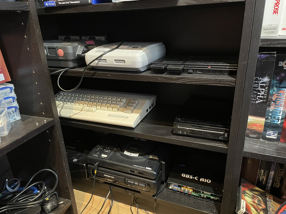 dinth1906's tweet photo. I have found a nice little corner and a permanent home for some of my consoles (and one computer! ;) #Retro #RETROGAMING #retrogamer #RetroBattleStations https://t.co/ZWIzE35FBF