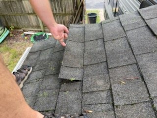 StorlaKenneth's tweet photo. I hate that I have This is what @StateFarm says "is normal wear and tear on a roof and the fact it happened during an actual storm where I got rain/hail damage is perfectly normal.  3 contractors found over 60 areas of damage and the claim was denied except 200 of trvial dollar. https://t.co/QoyCy3ozXA