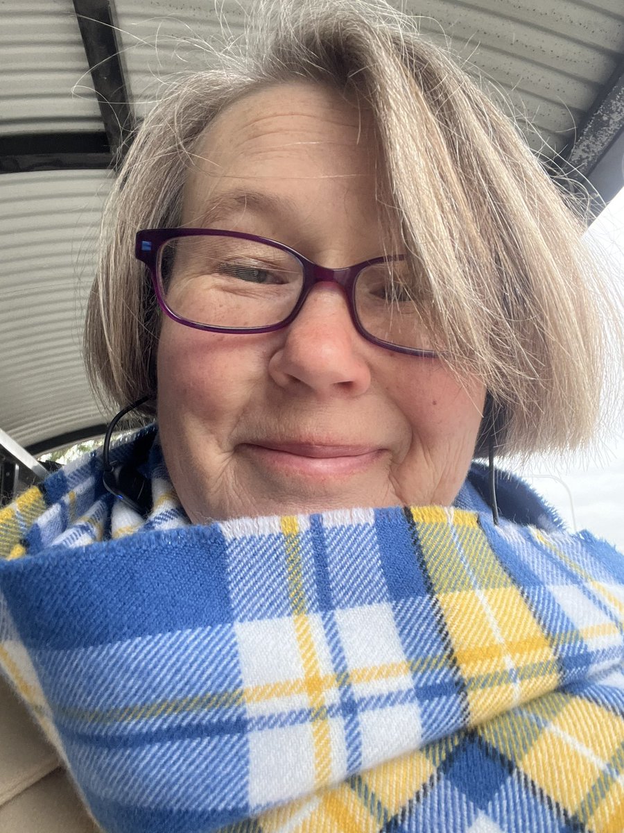 WeRWorld's tweet photo. I always wear bright colours on dull days. Despite being nearly 6ft tall, walking with crutches, I’m often not ‘seen’. I also have a great fear of being hit by a car. Anyway, todays scarf is @StyleGreatScot ‘Ukraine Forever’ tartan. A fundraiser for Ukrainian refugees. https://t.co/4tTcbSXM0B