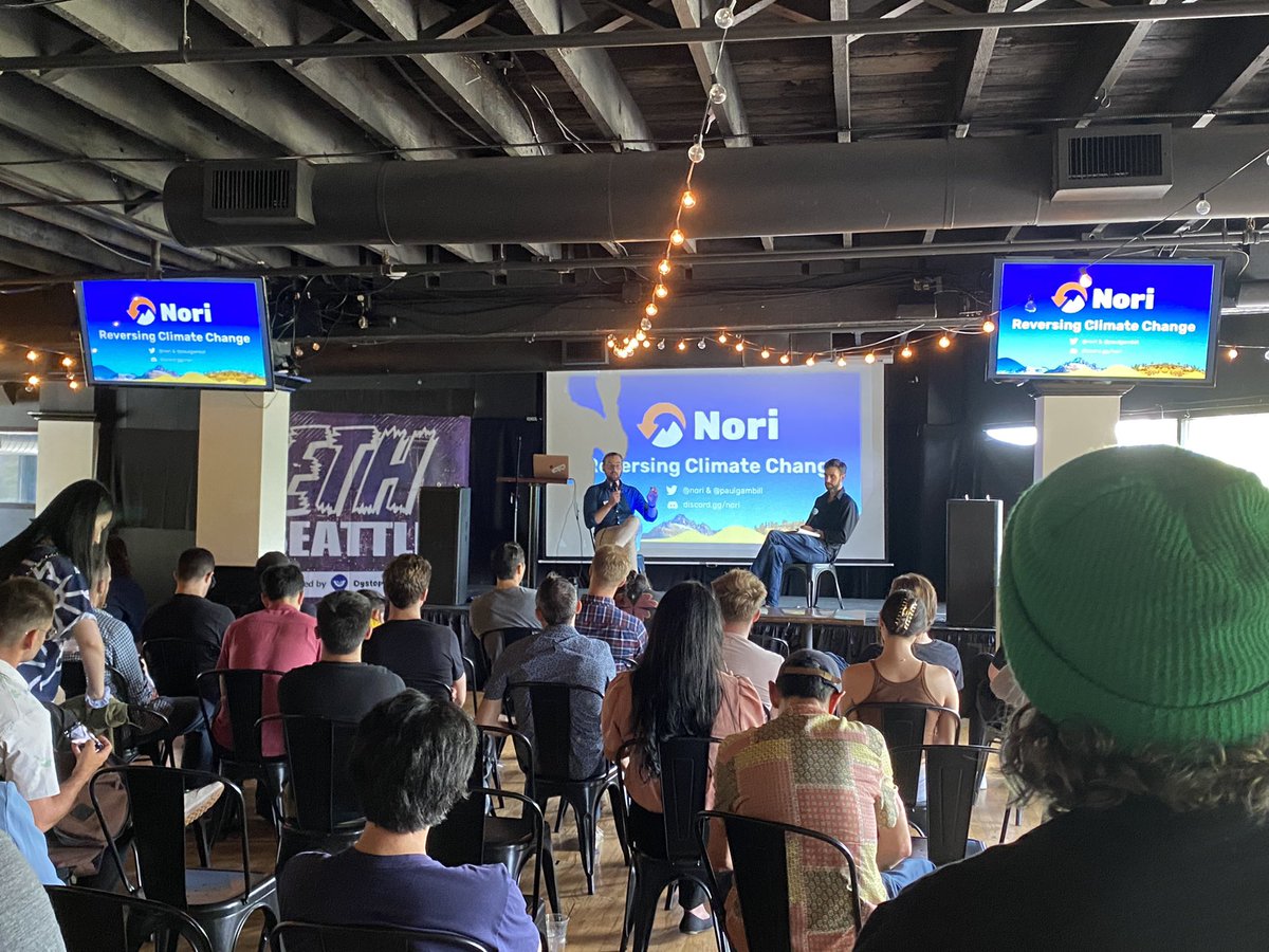 Hometown #ReFi heroes <a href="/nori/">Nori</a> with <a href="/paulgambill/">Paul Gambill</a> on the stage at <a href="/ETH_Seattle/">ETH Seattle</a>. Woot! 🌱