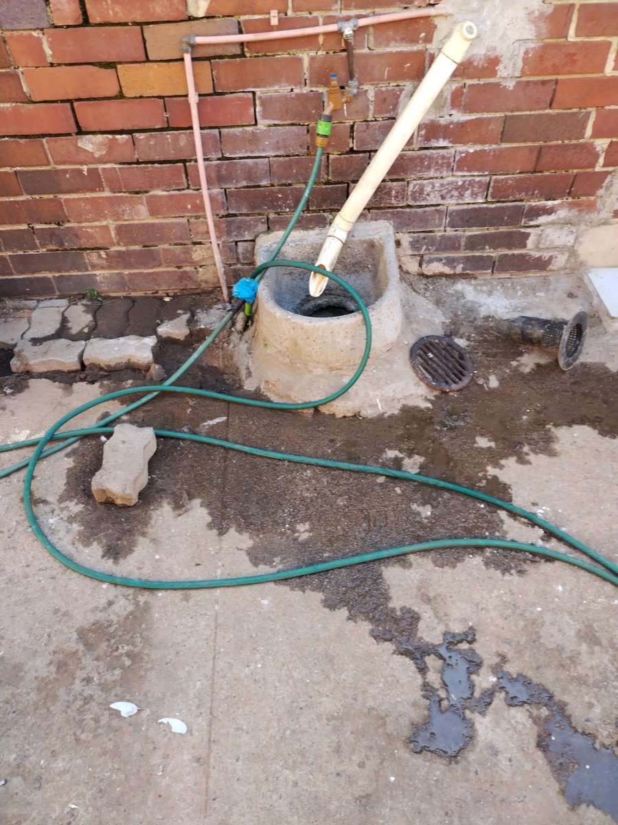 NjunjuSulupha's tweet photo. @JoburgWater it's been weeks now and no services. This is a burst sewer outside my grandmothers house. It has affected both gates. https://t.co/U6o5sUTZbO