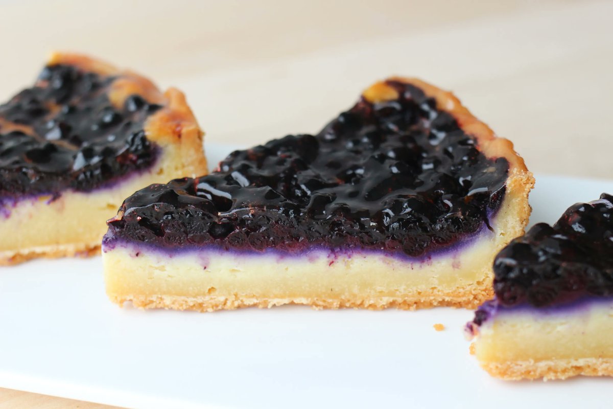 Our Blåbær Tærte screams summertime with a topping of blueberries, complimented by our custard and almond paste filling &amp; shortcrust base. You can also custom order a whole tart for special occasions on our website or by calling customer service 905 828 1777x1.