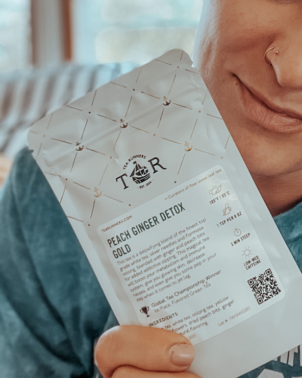 AND THE WINNER IS.... 🥇
1st Place Global Tea Championship Winner - Flavored Green Tea

This tea is a detoxifying blend of the finest top grade white tea, silver needles and Formosa oolong, blended with ginger and peach bits for added addictive sipping. 

This magical tea will