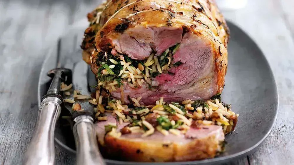 This flavoursome rolled shoulder of lamb with rice and kale stuffing is a fusion of Asian and British ingredients; pilau rice, fresh kale, sultanas and toasted pinenuts. It's a splendid roast for a Sunday lunch or dinner with friends. bit.ly/30tBATY #crouchend
