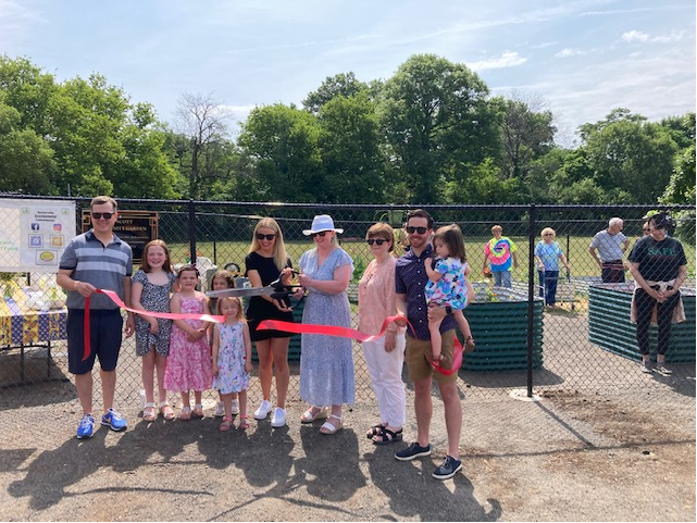 Scott Family cuts the 1st ribbon at today's ceremony for the Jay Scott Community Garden