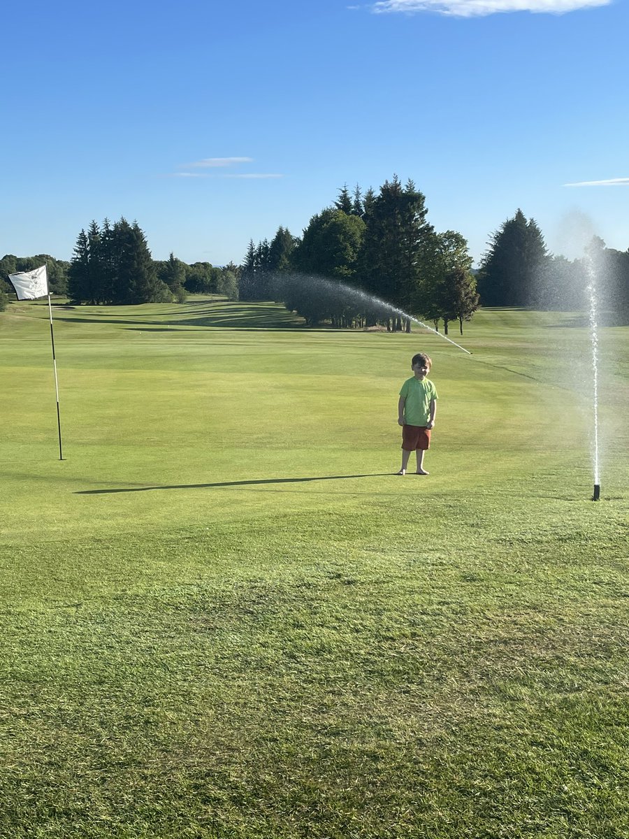 plwilkie's tweet photo. Giving the greens @muckhartgolf a little drink before another hot one tomorrow, my wee helper is keeping me right. #greenkeeping #helpershavingashower #funwithdad https://t.co/A1VPNJHczb