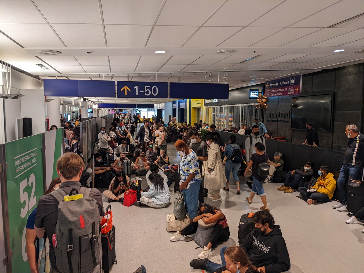 KeithButler20's tweet photo. What a terrible experience flying with #AirCanada thru Montreal.  We have to sit on the floor in the hallway. No access to gate seating.  Get your s**t  together #AirCanada https://t.co/GQbz1o2QHx