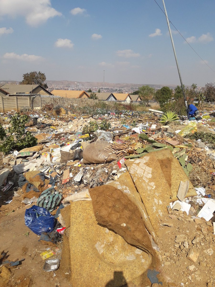 A side walk blocked by rubble at Citron street Lotus Gardens