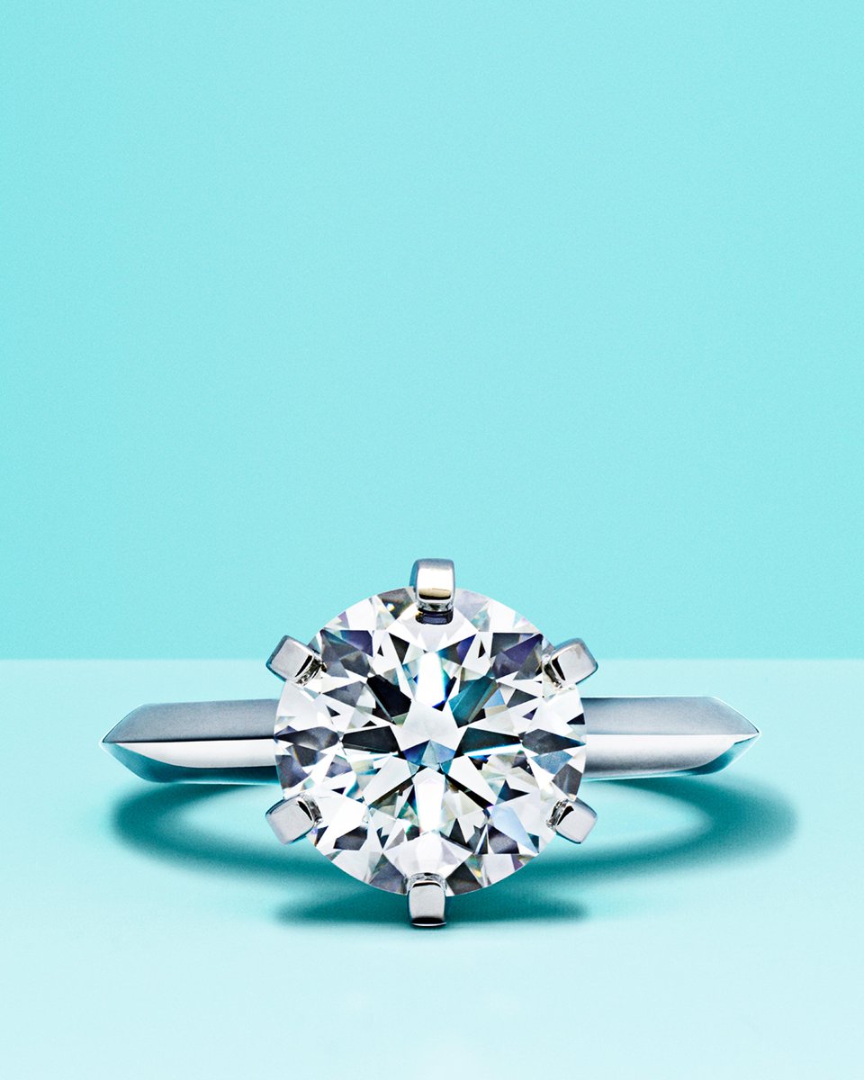TiffanyAndCo's tweet photo. Introduced in 1886, the Tiffany® Setting lifts a round brilliant diamond above the band with six prongs, maximizing the stone’s brilliance. For over 135 years, it has defined the engagement ring as we know it today. Learn more: https://t.co/XBeJgnYUZF #TiffanyEngagement https://t.co/mIoiWfvfy6
