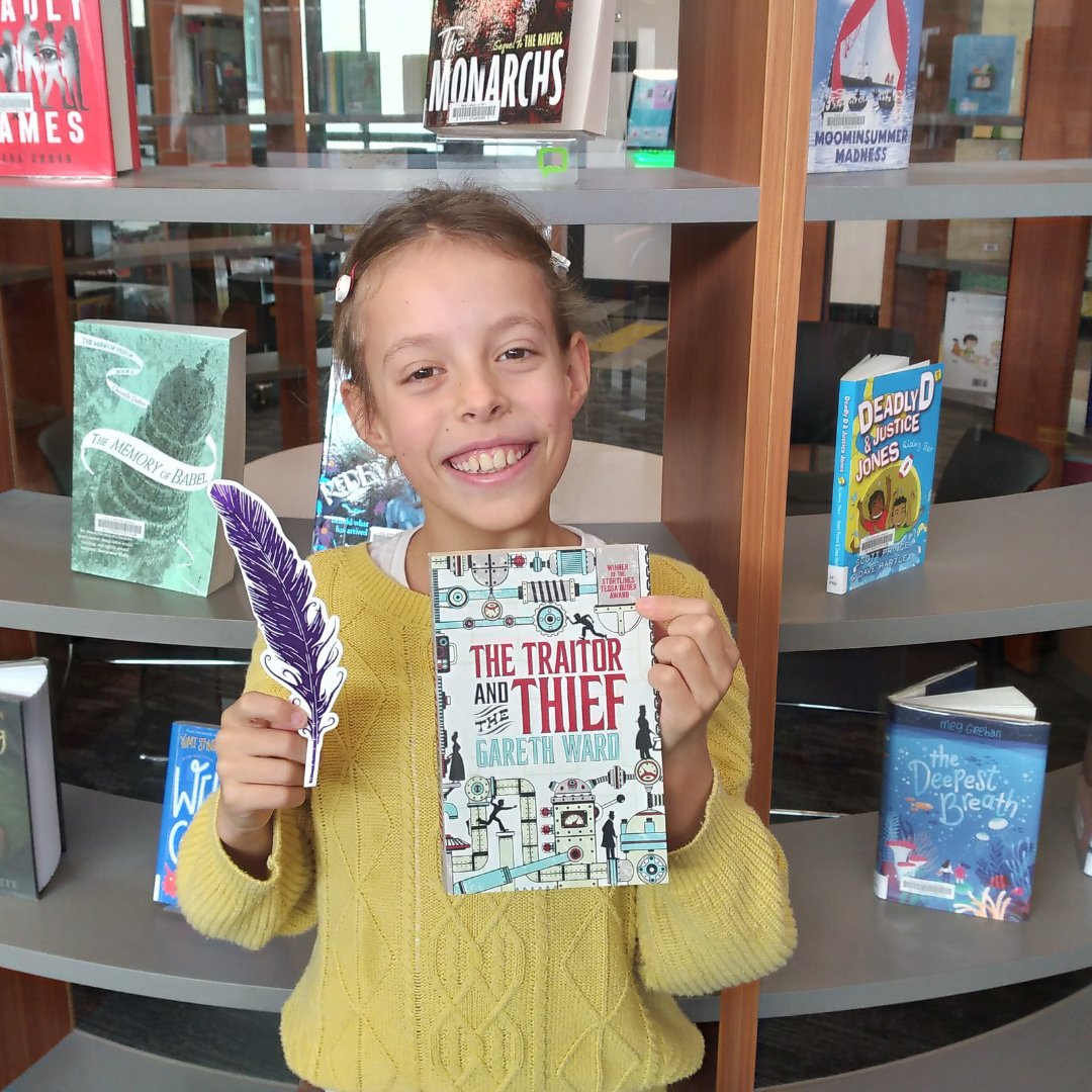 cityofmelville's tweet photo. The @scribblersfest #GoldenFeather hunt has begun! Lucky Ivy is our first winner, finding an Amethyst Feather at AH Bracks library + Creative Space. #perthnews https://t.co/eb9Tzh7lSW