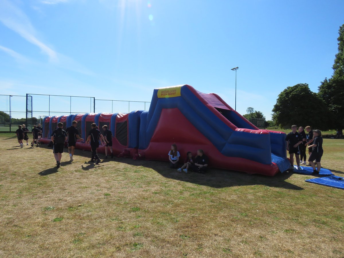 Manor_School's tweet photo. Students who achieved their Gold, Platinum or School Colours awards this academic year attended #REACHFest today, where they could play carnival games and enjoy inflatable amusements out on the field. Last year's winners also attended as their previous event had to be cancelled. https://t.co/mWQwXyMB6x