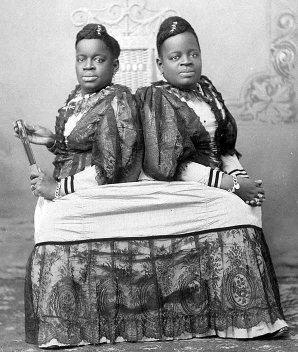 NC_Markers's tweet photo. #OnThisDay in 1851, Millie-Christine McKoy, conjoined twins, were born into slavery in Columbus Co. Known as as the “Carolina Nightingale,” they traveled the world, learned several languages, and met Queen Victoria, who gave them matching brooches. https://t.co/dQKWY8hoe8 https://t.co/llY4jfekRI