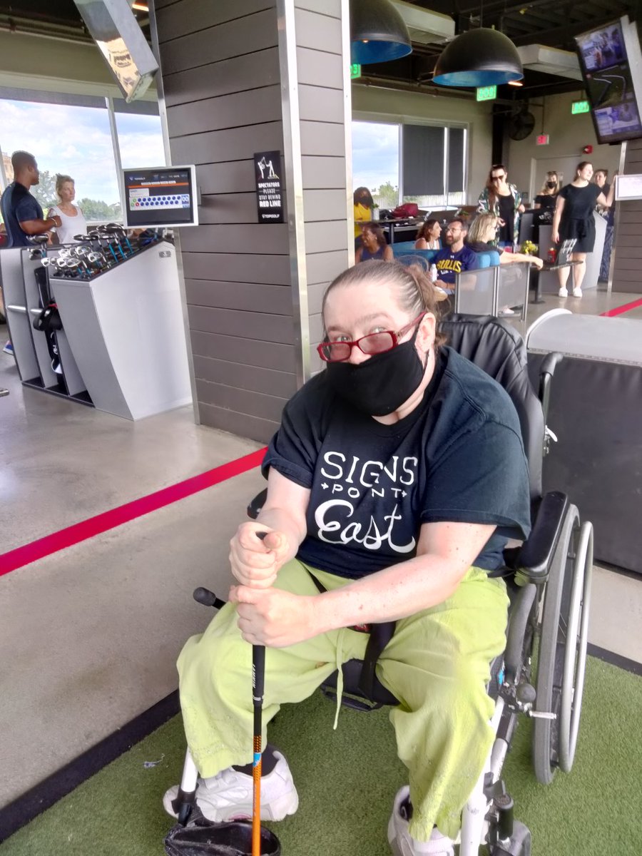 It's a good day for golf!

Brandi loves Top Golf. Have you been there?

[Image description: Brandi is seated in her wheelchair. She is holding a golf club and wearing a mask, but "smizing" for the camera].