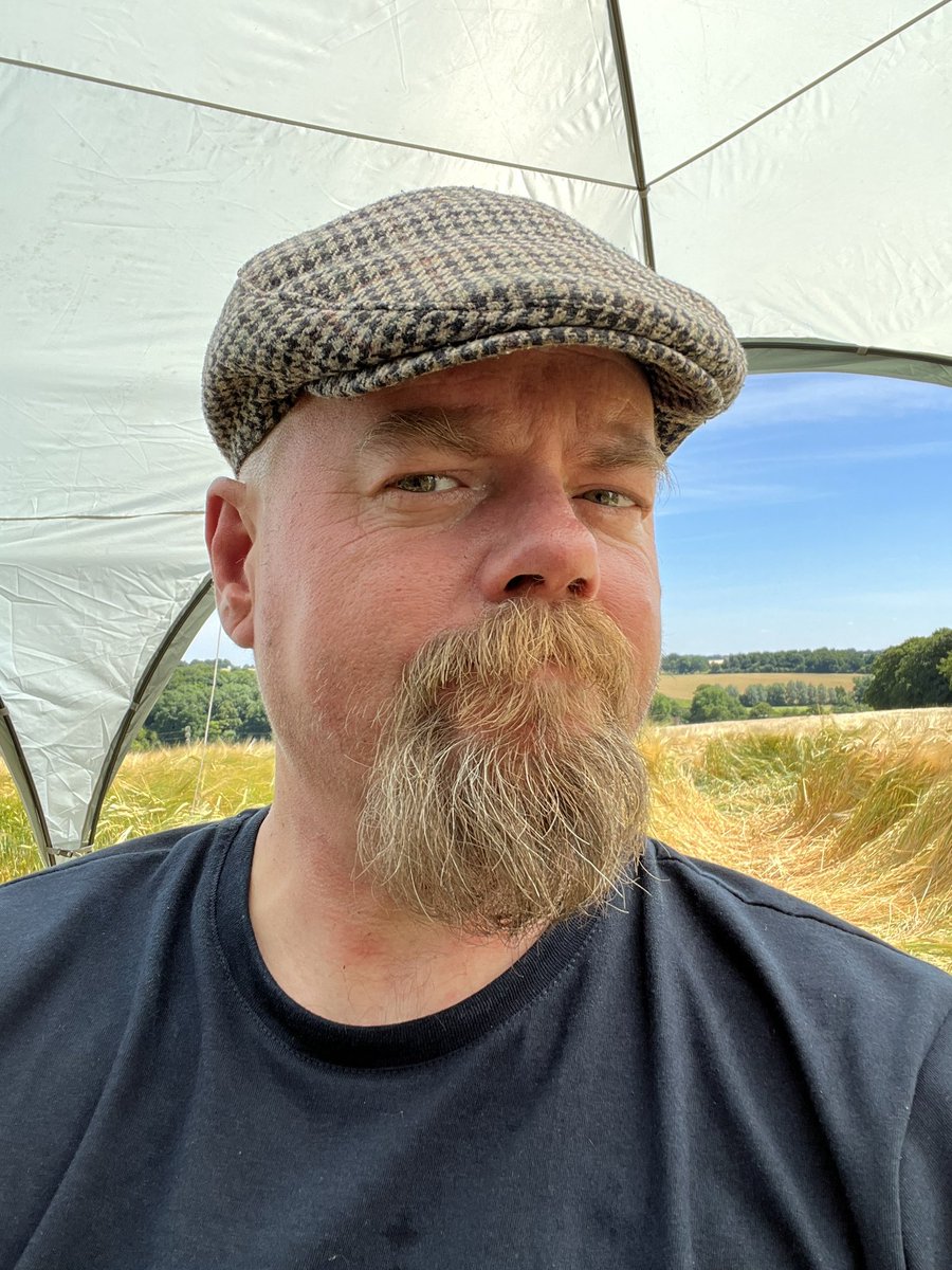 jonathanboakes's tweet photo. Roasting hot day working in fields of golden corn; it whispers to me on the breeze. #summer #july #folkhorror #strawface https://t.co/uvY4rYGID0