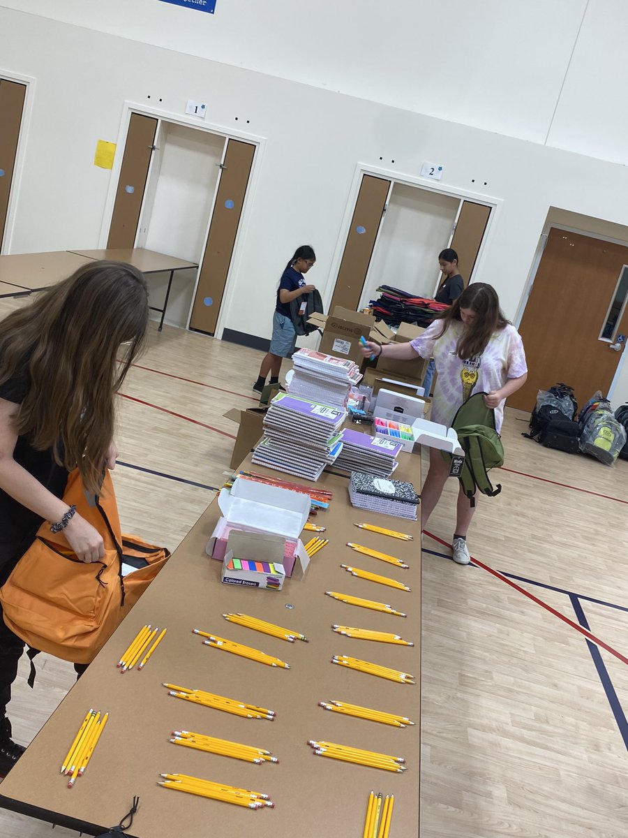 MBordanaro's tweet photo. OPS and SLE Student volunteers, Mrs. Liz, our Summer Lake custodians, and Bethel Island Children Support Board members helping to stuff over 200 student backpacks to be distributed to our students residing in Bethel Island. https://t.co/cqgBkgZqNp