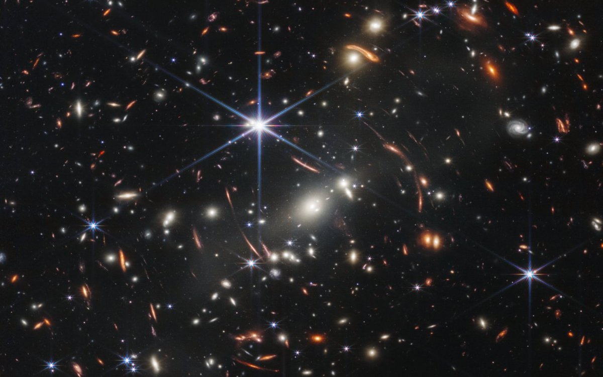 engadget's tweet photo. First James Webb Telescope image shows 'deepest' view of the universe ever https://t.co/rwYfcRNKsC https://t.co/5r9r9o0Sfb