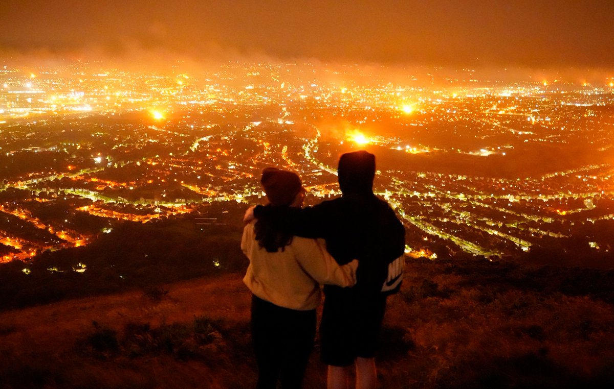 niallcarsonpa's tweet photo. The First time I've ever walked up Cave Hill never mind in the dark. But the view of Belfast's #11thnight  #Bonfires from Napoleons Nose is quite something. https://t.co/BDWcXMLCSi