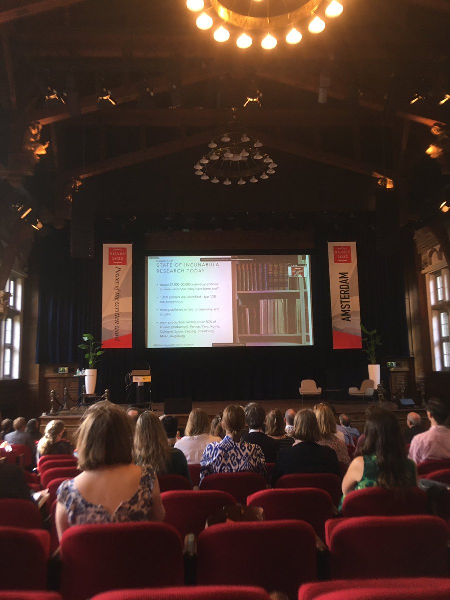 AlexisWeedon's tweet photo. #SHARP2022 #Sharp22 Deep in reading his wooden book in this magnificent hall above the keynote with an ambitious agenda for future research. https://t.co/j1D5P3Xtn2