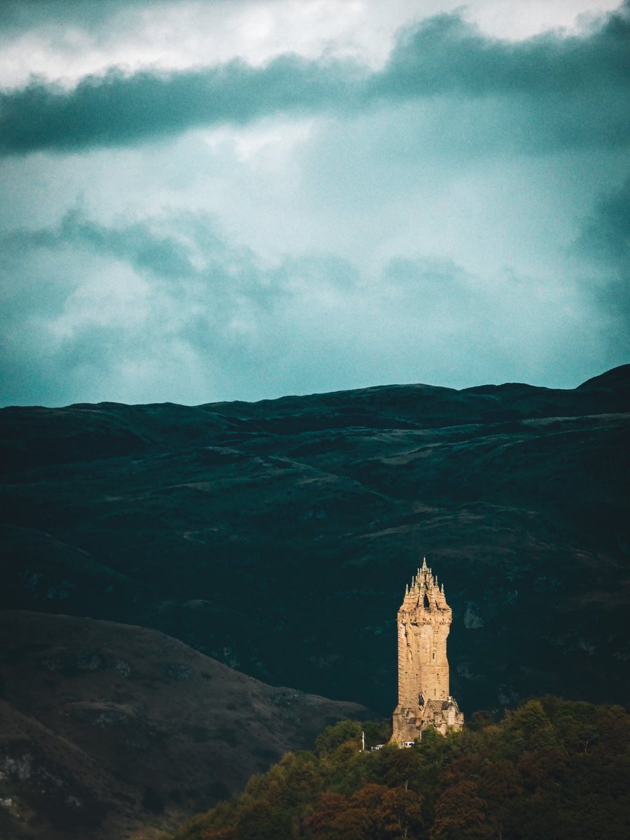 The @TheWallaceMon shinning against the broody Ochils. 
#scotland #stirling #scottishhistory #wallacemonument