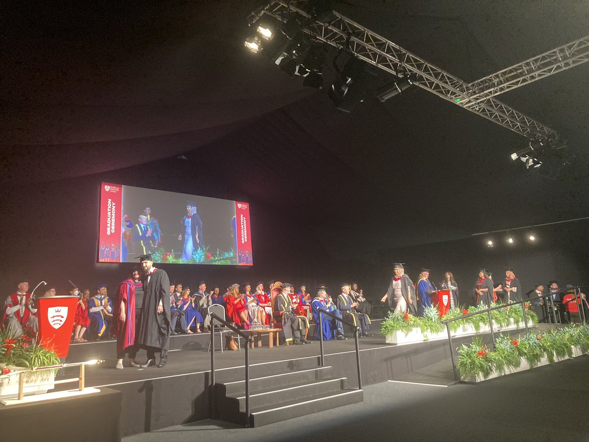MDXbusiness's tweet photo. Academic staff member Simon Roberts is now calling out the names of @MiddlesexUni graduates 🎓 in BA Business Management at our summer graduation ceremony!!! @MDX_BusAndLaw #graduation2022 #TeamMDX #graduate 🎓❤️📣🎉 https://t.co/Wwf5tbr6Nx