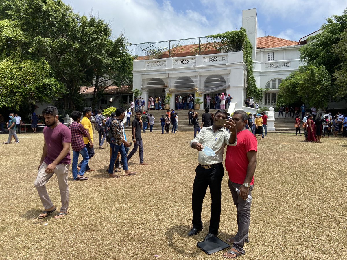 On the manicured lawns of the residence, known as Temple Trees, some took selfies.

In the shade under thickets of trees, families with young children picnicked. 

A vendor walked through, selling lottery tickets.