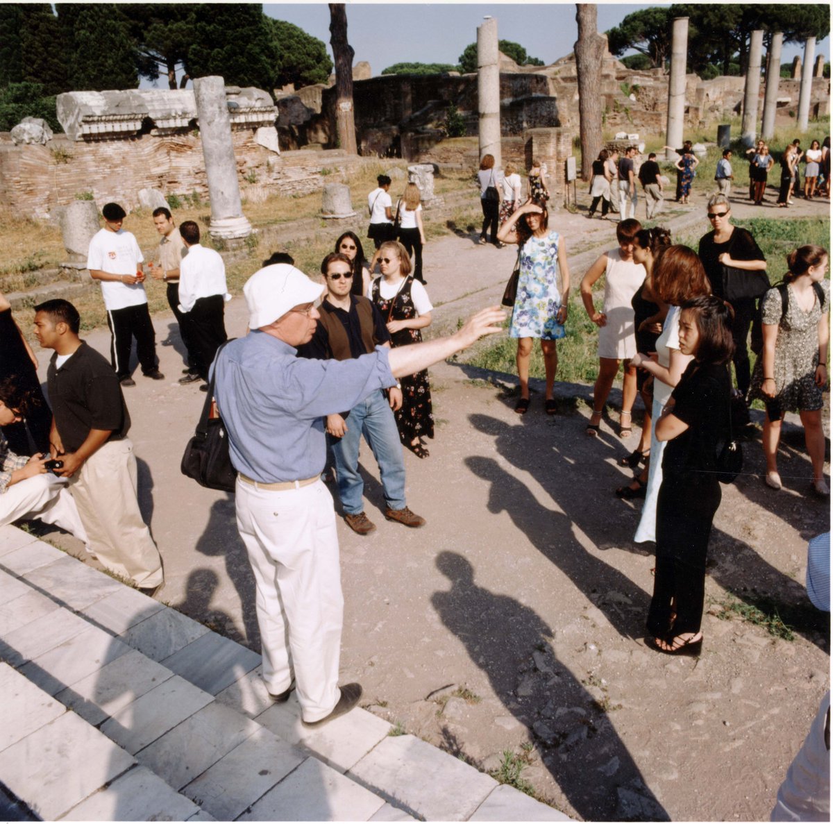 LUCArchives's tweet photo. Professor John Nicholson lectures his Rome Center class at Ostia Antica. (Photograph: Greg Gaymont, 1998) #LoyolaChicago https://t.co/1rZIrzXYPJ
