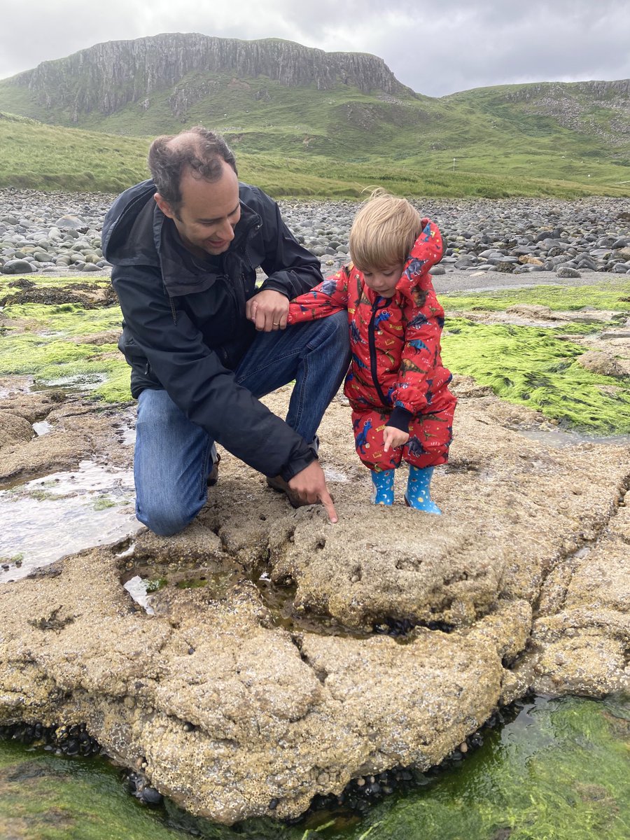 SteveBrusatte's tweet photo. Tracking dinosaurs on the Isle of Skye and teaching my wee field assistant the family business. https://t.co/E8mP8g89LQ