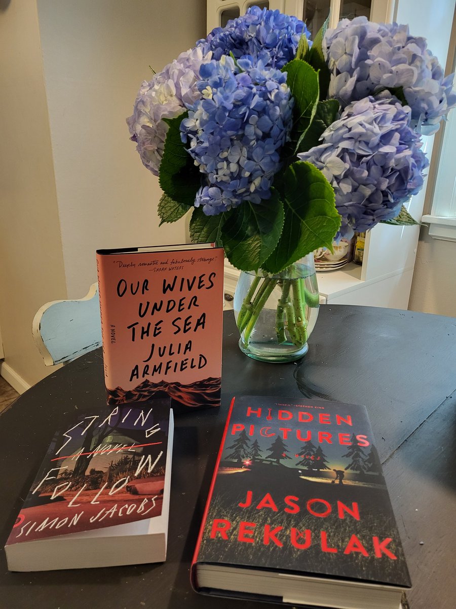 Pub day flowers from @joannamackenzie. Book treats because I couldn't walk into a bookstore and not BUY. (And an additional happy pub day to @JuliaArmfield whose book is first on my TBR).