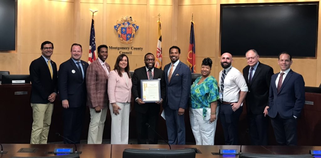 MoCoCouncilMD's tweet photo. CMs Jawando, Rice &amp; Navarro present a Council proclamation to celebrate Johnathan Dunn of Sherwood High School for being recognized as @MCPS’ Teacher of the Year. We appreciate all you do to educate &amp; enrich the lives of young people. Congratulations Johnathan! @theshswarrior https://t.co/XMQTb0rP68
