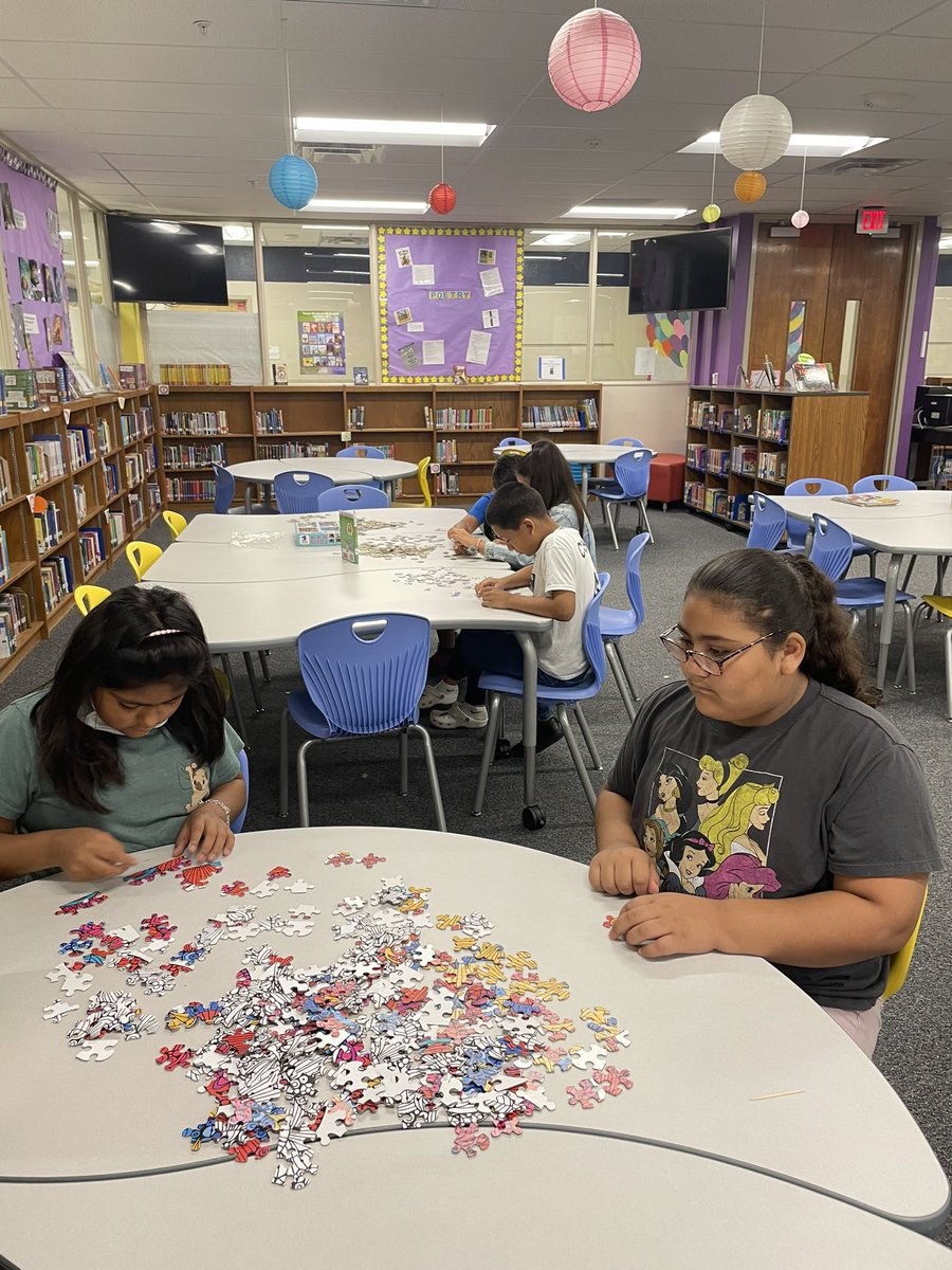 MickelsonMrs's tweet photo. Having fruit kabobs and looking at recipe books in the library. Also, making puzzles in the library. @MVESummerSchool https://t.co/yMd7OXOzzU