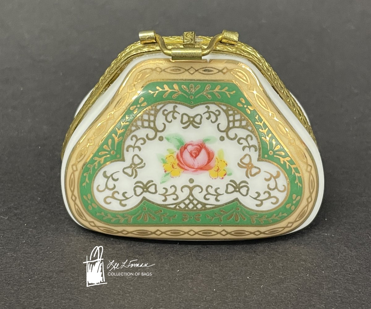 196/365: This miniature ceramic is shaped like a decorative clutch purse and can even be opened like a clamshell. The pattern appears to be hand painted. 