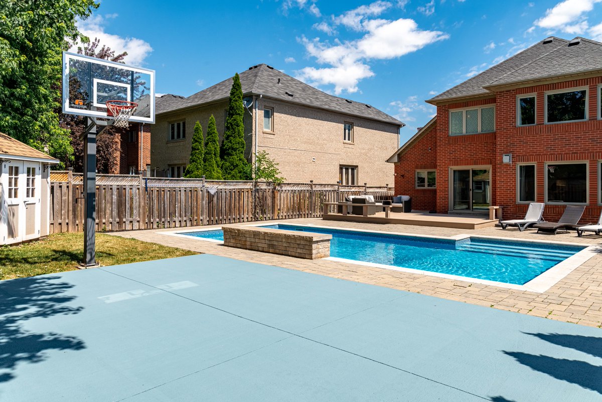 #ForSale The back garden of this beautiful Oakville home features a salt-water pool with waterfall feature and a pad for outdoor sports. Perfect for families and summer! 😎 Learn more at our website - robertsonkadwell.com