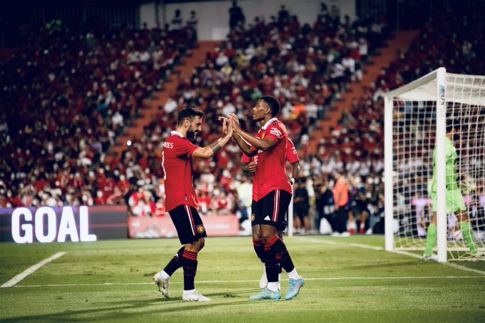 Bruno Fernandes and Anthony Martial celebrate the patter’s goal during our 4-0 win over Liverpool at the Rajamangala Stadium.