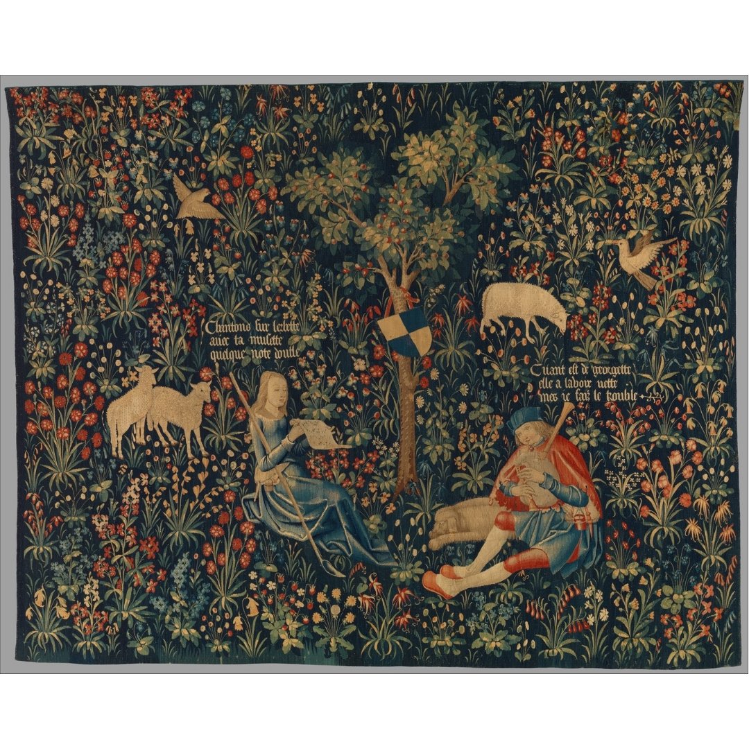 A tapestry of a shepherd couple playing music, surrounded by flowers and sheep.