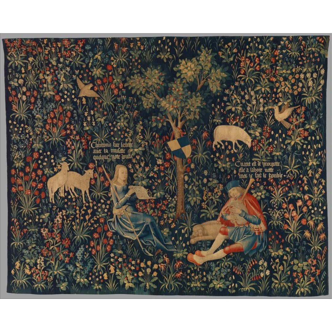 A tapestry of a shepherd couple playing music, surrounded by flowers and sheep.
