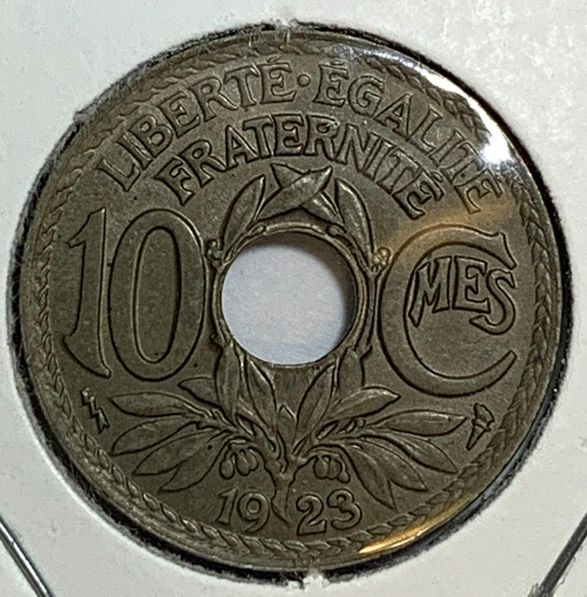 BaltimoreCoins's tweet photo. In honor of #BastilleDay on July 14, we are featuring French coins all week. This is a 1923 10 #Centime #coin. The series was minted from 1917 - 1938. The lightning bolt below the "1" on the reverse is the mintmark for the Poissy mint. Mintage = 30,015,701. #numismatics #coinclub https://t.co/X5x7Obtjlc