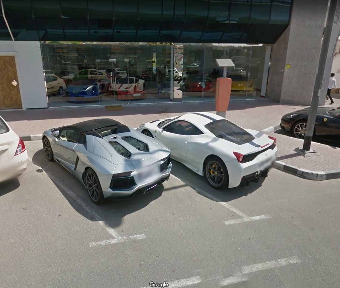 Cars_SV's tweet photo. A Lamborghini Aventador Roadster and a Ferrari 458 Speciale would be a special pair on their own, but hidden in the background, inside a dealership window is the unmistakable front end of a Gemballa Mirage GT

Dubai - September 2015 #SV_Supercars #StreetViewCars https://t.co/bcmsLUUduT