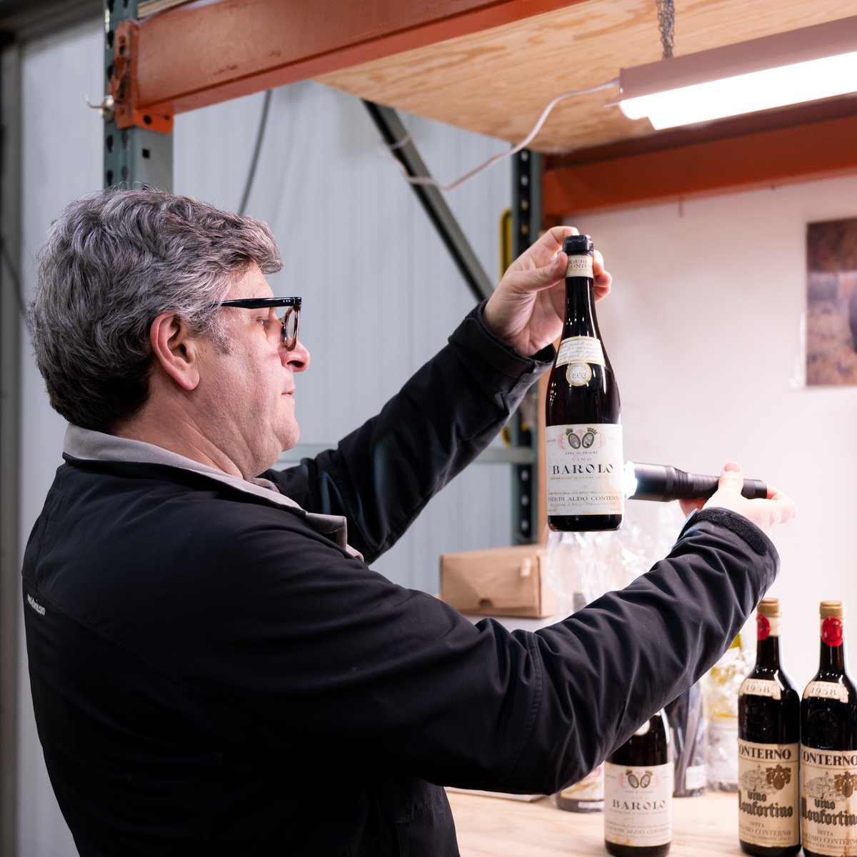 hdhwine's tweet photo. SVP Allan Frischman carefully inspects bottles as they arrive at our Delaware facility. Thinking about consigning in September? Reach out today: consignments@hdhwine.com #wine #wineauction #finewine #rarewine https://t.co/zqodW2QI8q