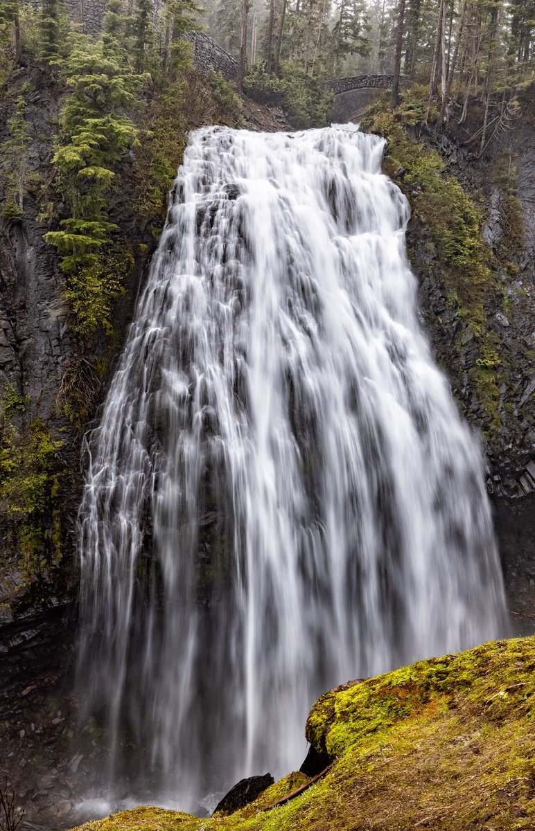 Betchel's tweet photo. On a blistering hot San Antonio day- I take solace in this image taken at Narada Falls (at Mount Rainier) last June.  We only got the shot by using ice cleats on our boots since an abundance of ice and snow were still on the mountain. https://t.co/gCsgXFGGpL