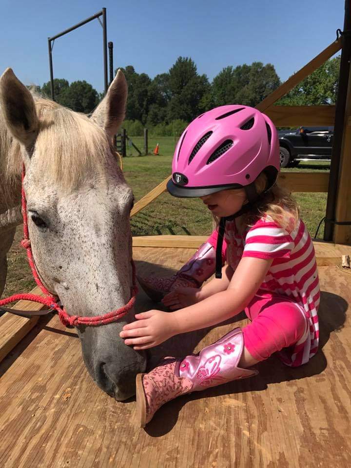 10 minutes before this picture she was having a melt down until voluntarily our main therapy horse walked up to calm her. After a good lick on the face she was golden.  Support great programs making a difference any amount helps paypal.me/DiegoRanchInc