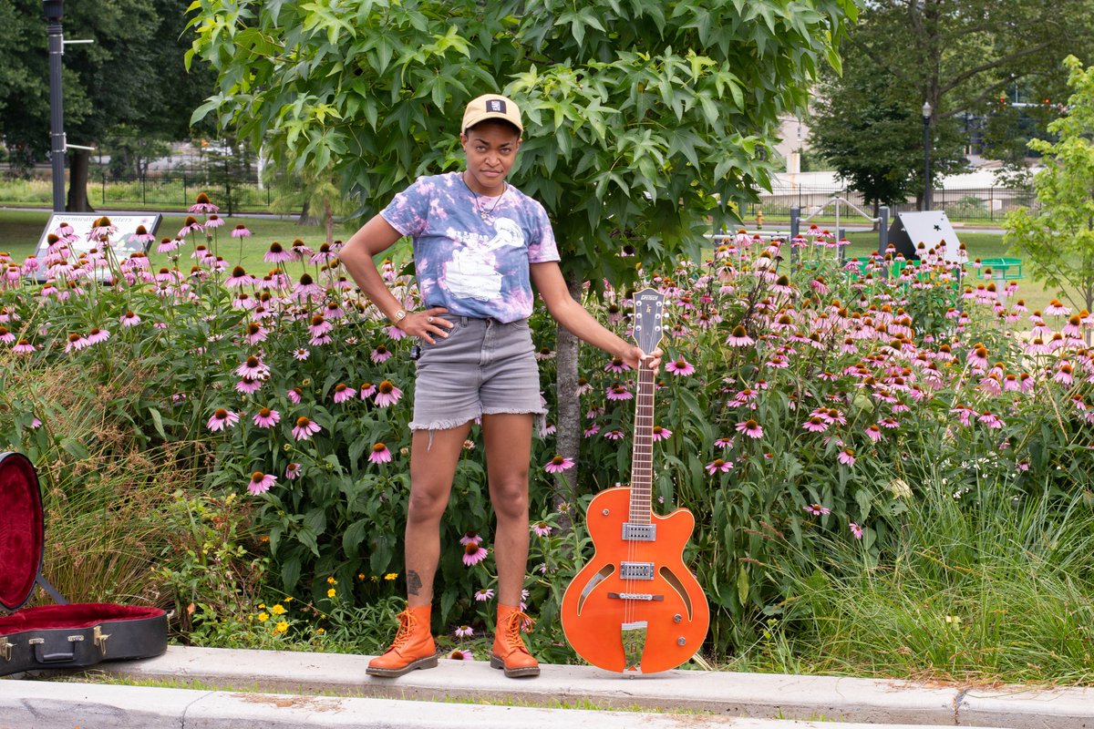 Haha, there she was, picking up and playing the orange guitar in our living room with those boots. Of COURSE that guitar has to go home with her!  😃     Go <a href="/SugDaniels_/">Danielle Johnson</a> !  I love ya! 
 Ha, and the shirt matches the flowers. That wasn't planned but I guess it was meant to be!