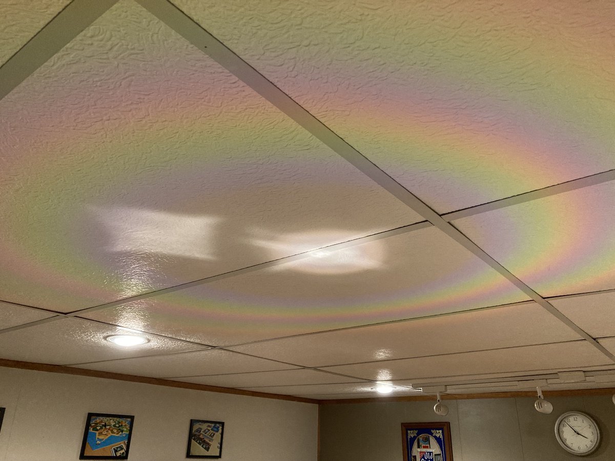 DaveSlaven's tweet photo. The rainbow is from one of the ceiling lights reflected off a CD. #optics #diffractiongrating #CanYouBelieveSomePeopleHatePhysics https://t.co/g6driWJNbn