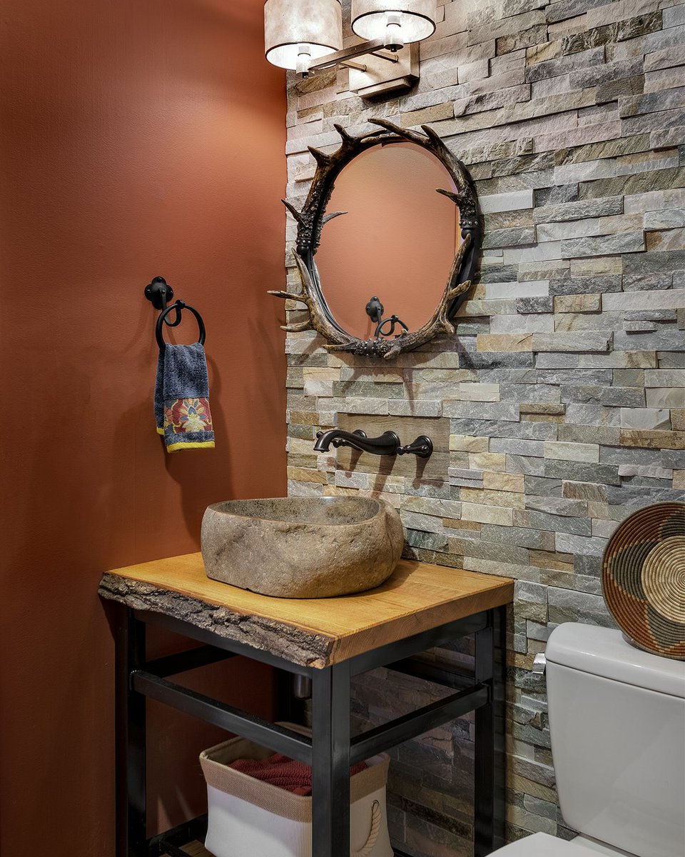 Our New Hampshire studio used earthy tones and textures to give this beautiful powder room a rustic appeal.

crtinteriors.com/loon-mountain-…