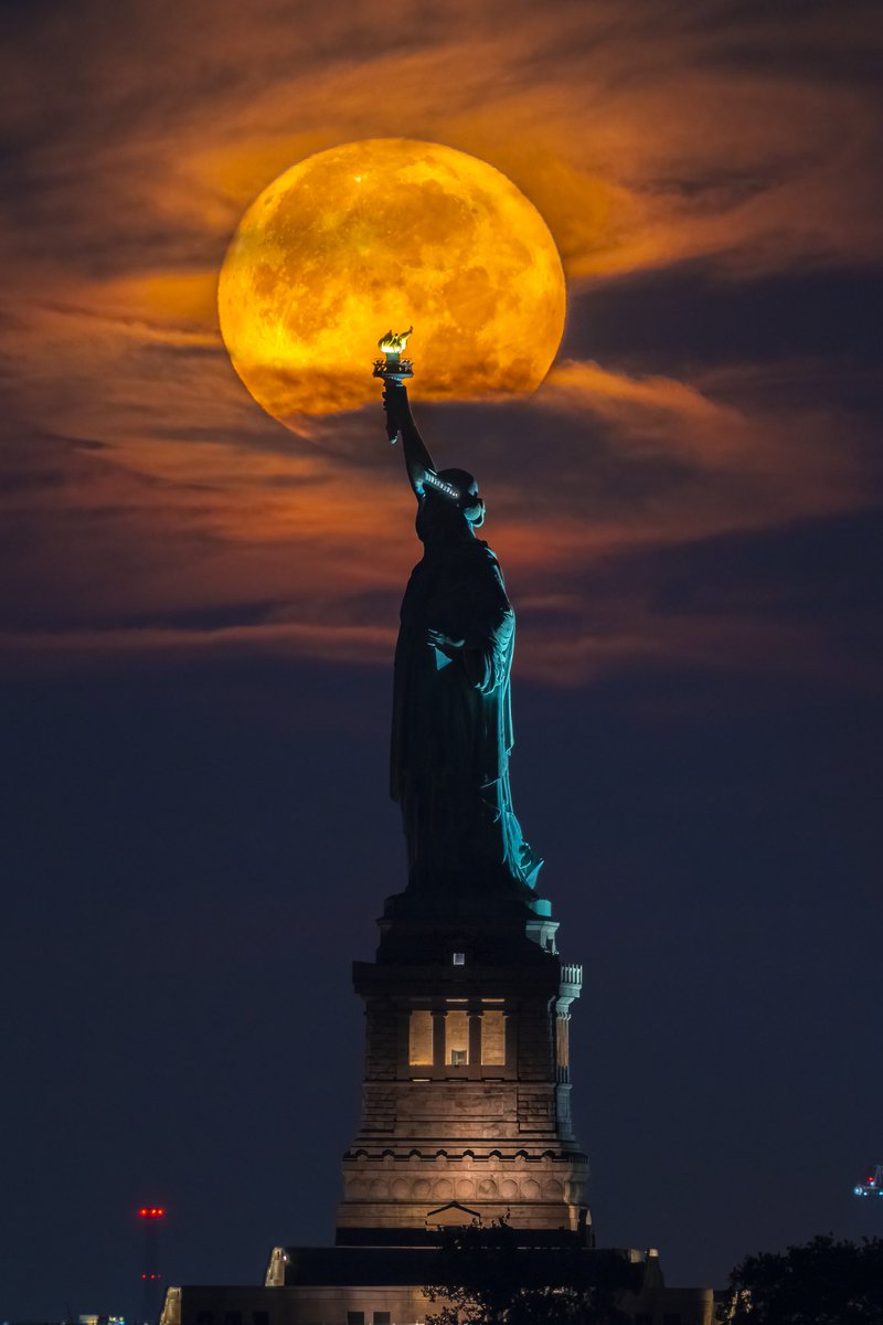 DanTVusa's tweet photo. This mornings view of the Supermoon setting behind the Statue of Liberty. #buckmoon #moon #supermoon #nyc https://t.co/shHHnVD2bN