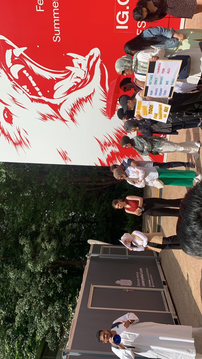 sam_9907's tweet photo. Trainees protest outside the #gphc Gphc building to raise their concerns and issues experienced with the June 2022 exam. It is unacceptable that students had to sit exams in the conditions they put us in, also the blueprint of the exam was not reflective of the samples questions https://t.co/Bntfh34eb0