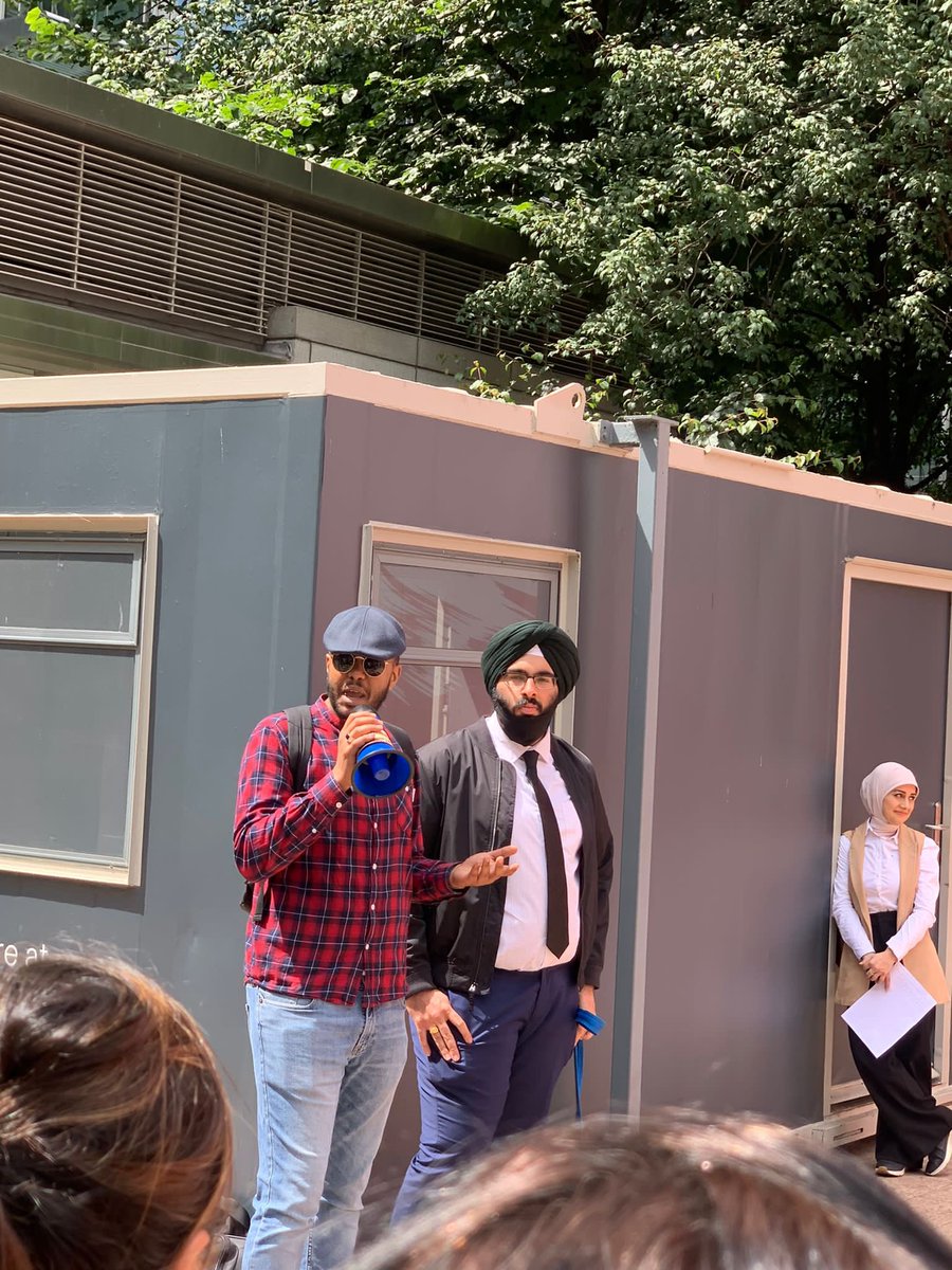 sam_9907's tweet photo. Trainees protest outside the #gphc Gphc building to raise their concerns and issues experienced with the June 2022 exam. It is unacceptable that students had to sit exams in the conditions they put us in, also the blueprint of the exam was not reflective of the samples questions https://t.co/Bntfh34eb0