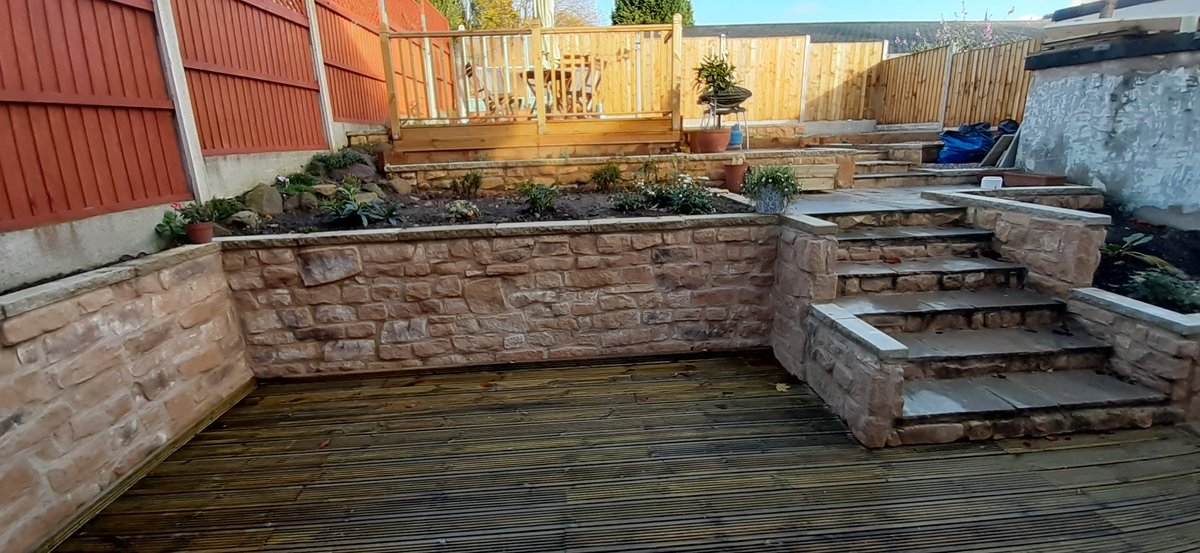 Our pre-cast Stone Slips / Tiles called Kopestone Golden Weathered used in a garden wall project. <a href="/HigginsCladding/">Higgins Wall Decor Store</a>